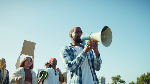 Man with megaphone leading protest