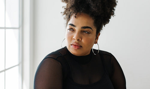 Stylish woman looking away and thinking