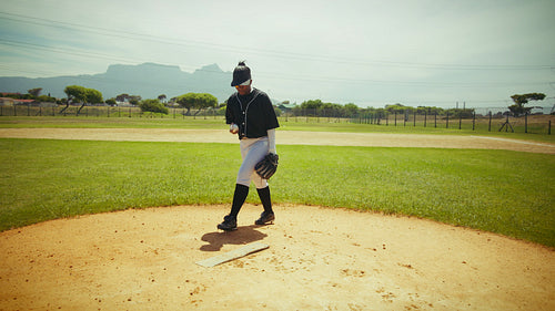 Pitcher prepares to throw a baseball on the mound.