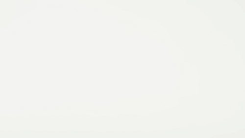 Contactless credit card payment being made using a modern blue terminal