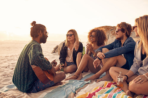 Young people having a party on the beach