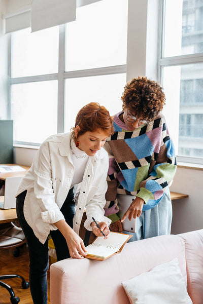Colleagues collaborating in bright co-working space