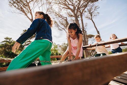 Group of children playing outside on a sunny day in a park