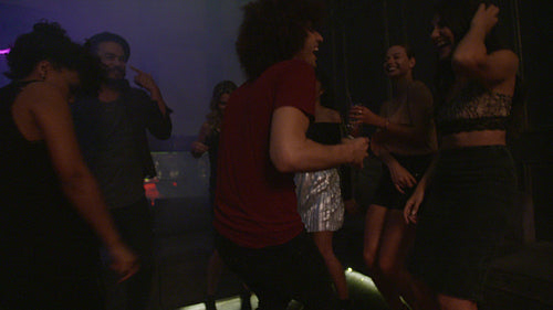 Friends dancing and partying at nightclub