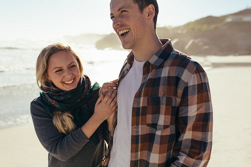 Cheerful couple together along the sea shore