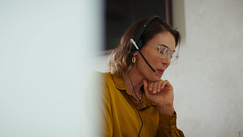 Businesswoman discusses business matters during a video call