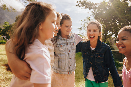 Happy friends enjoying time together outdoors on a sunny day