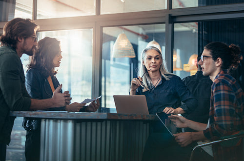 Business team discussing work in office