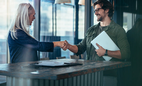Business coworkers hand shake after meeting