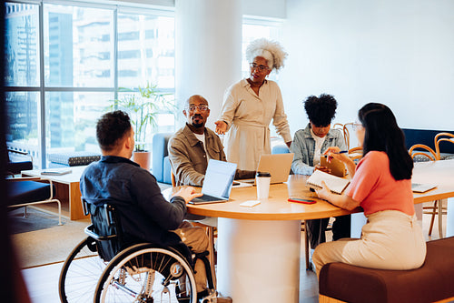 Team meeting with diverse group in office