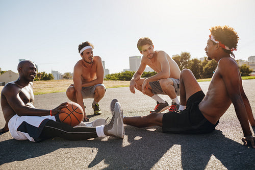 Men relaxing during a basketball game