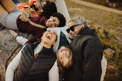 Friends laughing together during outdoor gathering