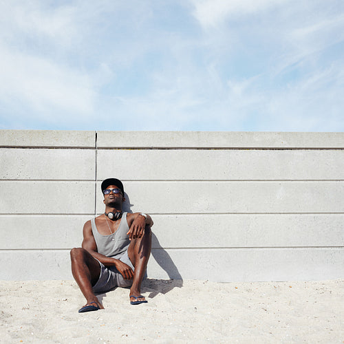 Young man relaxing on the beach
