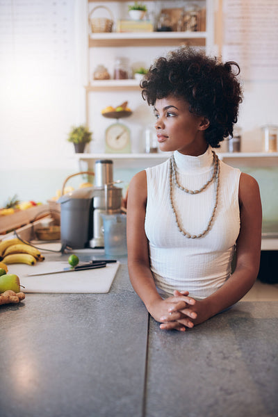 Young african woman at juice bar