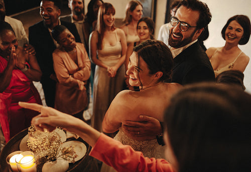 Happy wedding celebration with friends and family in an intimate setting