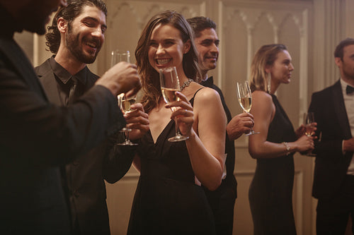 Group of people at a celebration event with drinks