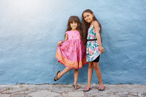 Two happy little girls posing together