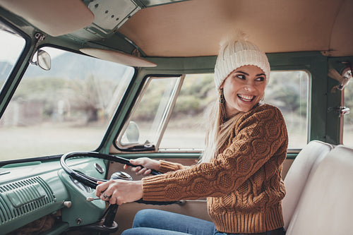 Woman on roadtrip driving a van