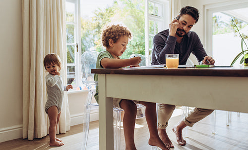 Man looking after kids at home
