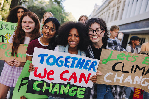 Happy teenage girls joining the global climate strike