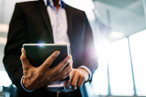 Businessman working on digital tablet in office
