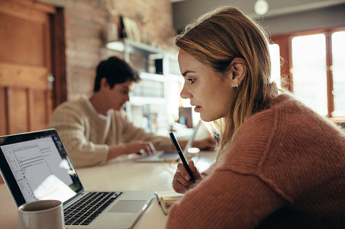 Woman working on laptop at home