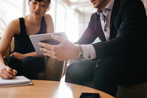 Businesspeople working together in lobby