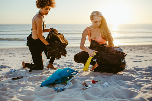 Surfers tidying up the beach