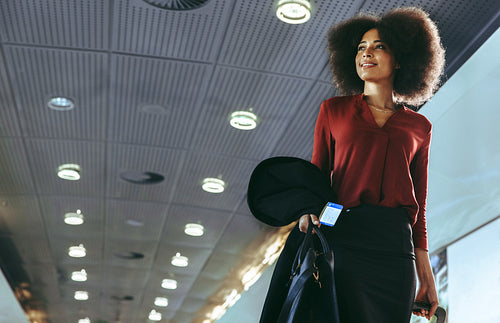 Woman walking in the airport corridor