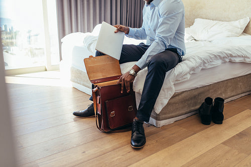 Man preparing his bag to go to office