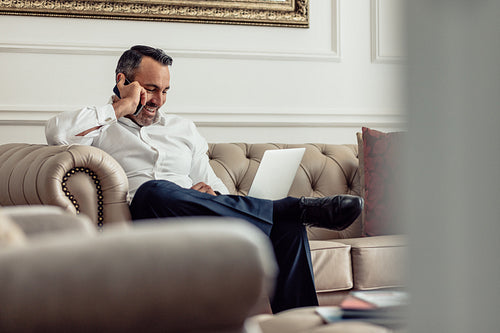 CEO on business trip working from hotel room