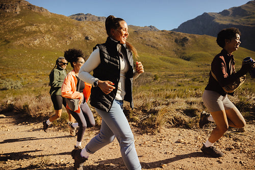 Group trail running in scenic mountains