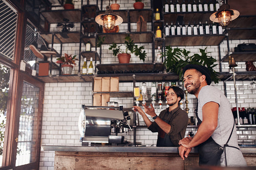 Coffee shop workers standing at the counter