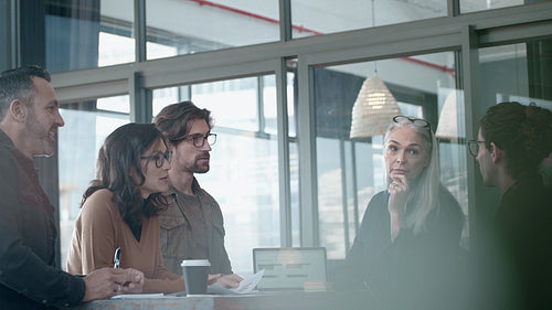 Happy business professionals in review meeting