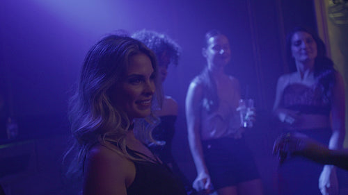 Attractive female dancing at discotheque