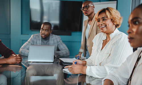 Group of colleagues having a successful business meeting in the office