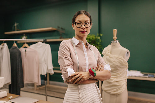 Fashion designer standing in her workshop