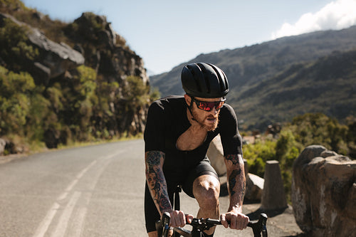 Cyclist riding hard on pro bike