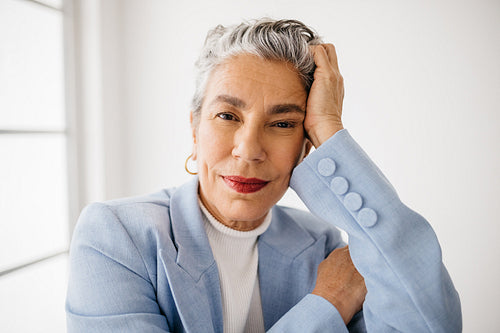 Empowered and classy: Business woman wearing a professional suit in an office
