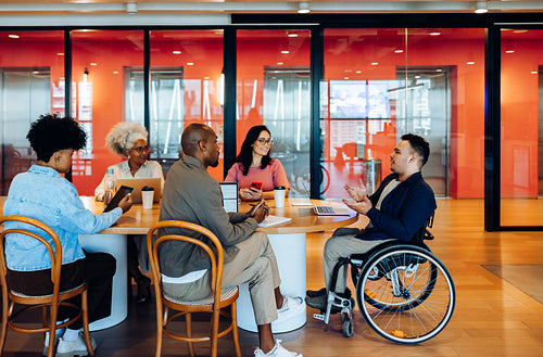 Business meeting around round table in modern office