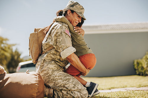 Military mom having an emotional reunion with her son