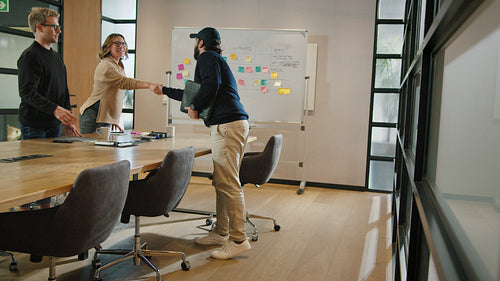 Business man arriving for meeting with his partners in an office