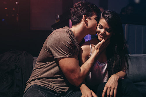 Young couple enjoying in the party at pub