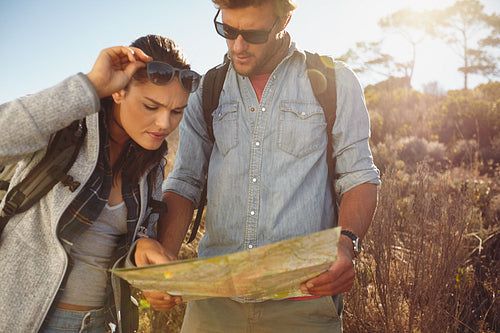Hikers looking at map for navigation