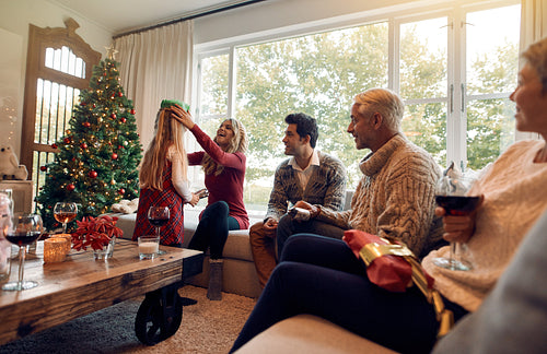 Family with little girl celebrating christmas festival at home