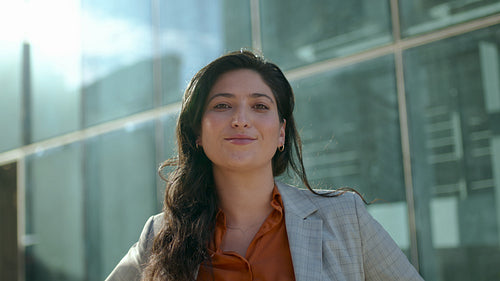 Confident young businesswoman standing outdoors