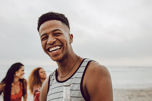 Handsome young african man on the beach
