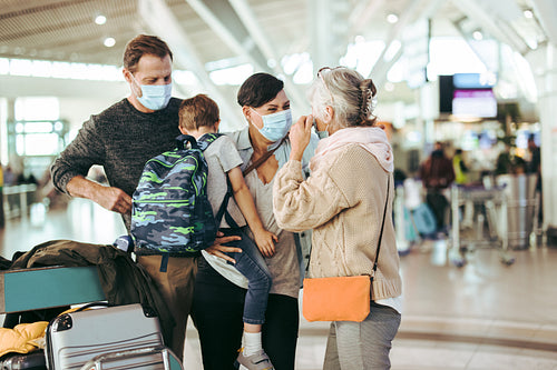 Family reunion at airport after pandemic lockdown
