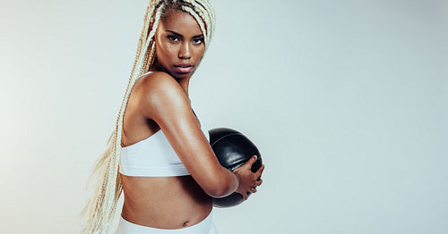 Woman doing work out using medicine ball