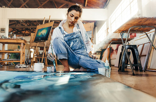 Talented artist making a painting on a canvas
